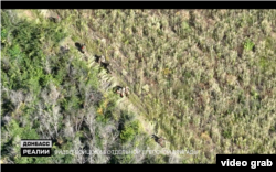 Російські військові евакуюють своїх поранених після невдалого штурму Надії