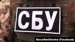 За даними СБУ, він відповідав за юридичні аспекти оборудки, зокрема, займався укладанням договору із структурами Росгвардії на охорону підконтрольної Шуфричу елітної нерухомості в Криму