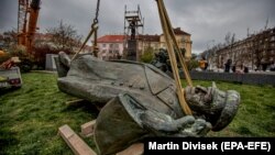 The monument to Soviet era World War II commander Marshal Ivan Konev lies on the ground after being removed from its pedestal in Prague in April 2020.