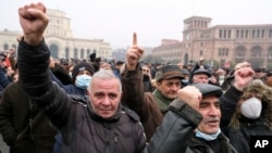 ARMENIA - Opposition demonstrators react while listening to a speaker during a rally to pressure Armenian Prime Minister Nikol Pashinyan to resign in Yerevan, December 22, 2020