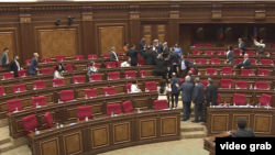 Armenia - Pro-government and opposition lawmakers clash in the Armenian parliament, May14, 2025.