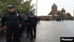 Armenia - Police guard the Hovanavank monastery during a Sunday mass held by a defrocked priest, October 26, 2025. 