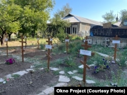 Могилы жителей монастыря в Никольском, погибших после начала полномасштабной войны