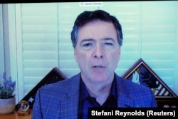 Бывший директор ФБР Джеймс Коми выступает по видеосвязи на сенатских слушаниях. 30 сентября 2020 года