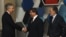 Turkish Foreign Minister Ahmet Davutoglu (center), accompanied by his Afghan counterpart Zalmay Rasul (right), shakes hands with U.S. Deputy Secretary of State William Burns before the Istanbul Conference on November 2.