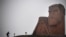 Nagorno-Karabakh - A man walks towards the statue "We Are Our Mountains" outside Stepanakert on November 12, 2020.