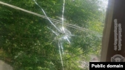 Armenia - A bullet hole on a window of a house in the border village of Khoznavar, May 29, 2025.